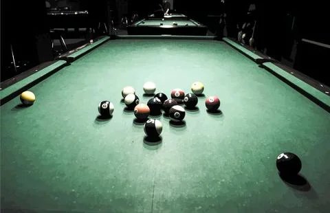Billiards balls scattered on a pool table Stock Photos