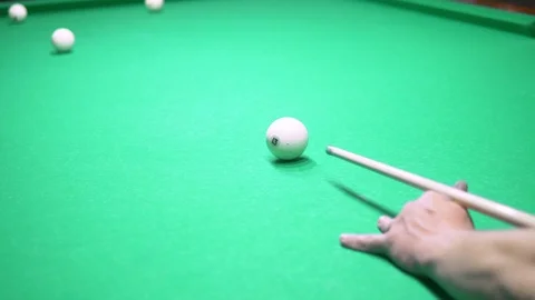 Billiards. Close-up. man hand with cue and white ball on a green pool table Stock Footage 117447753