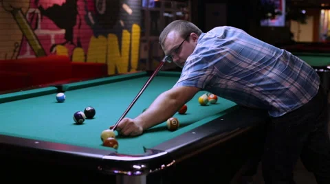 Billiards player pockets any ball in the hole Stock Footage 58201955