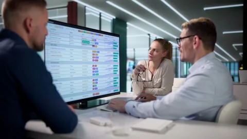 Billing Analyst And Two Colleagues Review Coding Spreadsheets Stock Footage 337224844