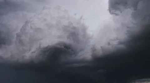 Billowing cloud mass beginning to twist at the edge, time lapse Stock Footage 59514031