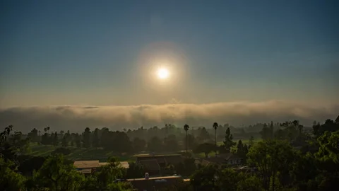 Billowing clouds over Ocean next to golf course Stock Footage 144511288