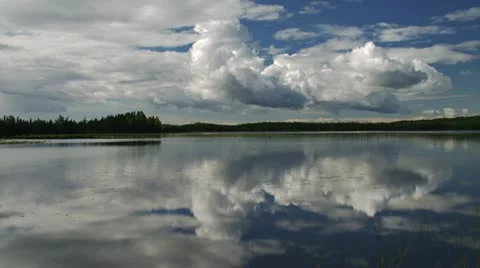 Billowing Cumulus Clouds over Windy Lake Timelapse Stock Footage 11914495