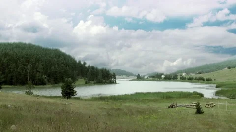 Billowing Cumulus Clouds Over Windy Lake Time-lapse Stock Footage 51920275
