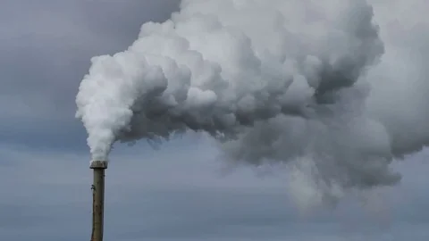Billowing steam from smoke stack across sky 4k, 60 fps for slow motion Stock Footage 78984556
