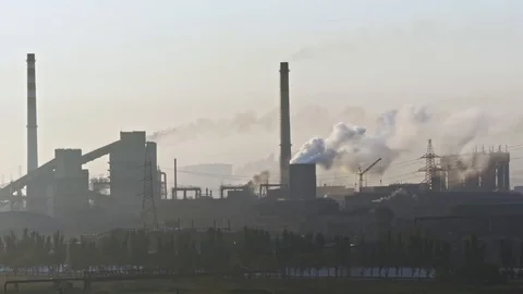 Billowing steam from smoke stack filling sky. Smoking chimneys of a steel pow 스톡 동영상 112775284