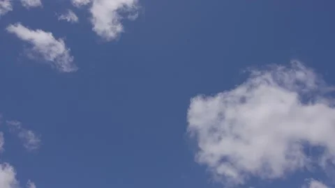 Billowy clouds dance thru a bright blue Los Angeles sky Stock Footage 153102475