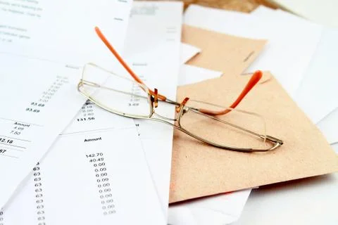 Bills and glasses Stock Photos