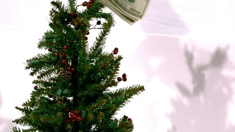 Bills on christmas tree slow motion Stock Footage 93787872