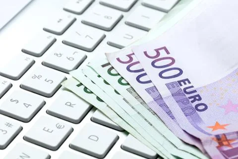 Bills on a keyboard Stock Photos