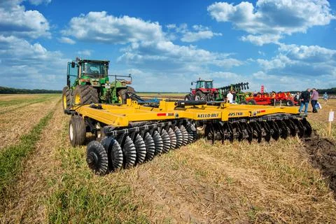 Bilogirya, Khmelnytsky region, UKRAINE - August 19, 2021: tractor with disc h Stock Photos
