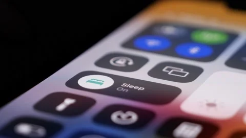 BILTEN - JANUARY 4, 2022, User enables sleep mode with a tap on touchscreen Stock Footage 168008700
