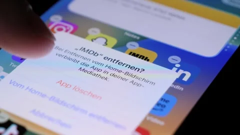 Bilten, Switzerland - 02/22/2024: Uninstalling IMDb app from the App Store Stock Footage 265525053