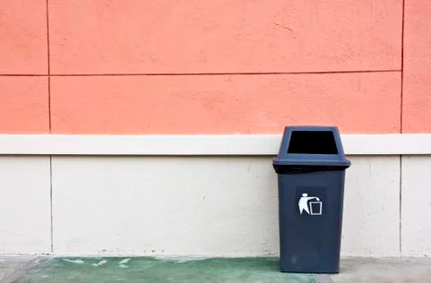 Bin and wall. Stock Photos