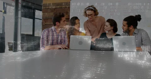 Binary code and data processing animation over diverse business team Video stock 303739898