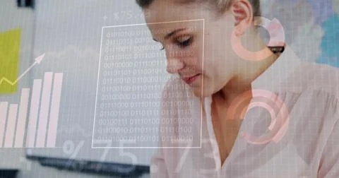 Binary code and financial data image over businesswoman working in office 스톡 사진