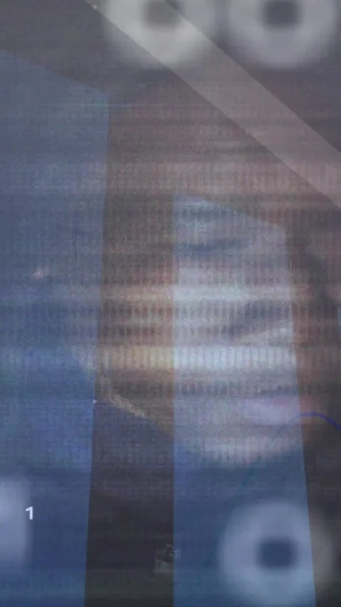Binary code and financial graph animation over blurred face in background Video stock 319810898
