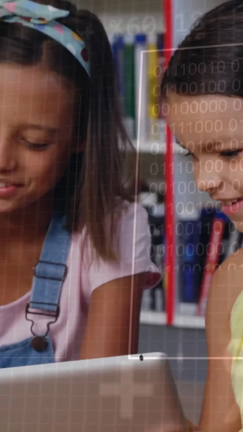 Binary code animation over children using tablets in school library Stock Footage 320034581