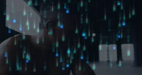 Binary code animation over person working on computer in dark room Video stock 303616102