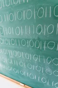 Binary code on blackboard Foto stock