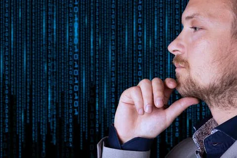 Binary code. A businessman looks at a background of digital binary code numbe Foto stock