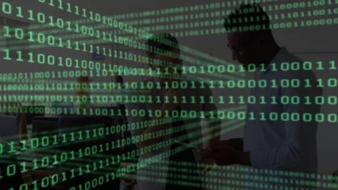 Binary code cascading over office while woman pointing laptop during tech Stock Footage 317184502