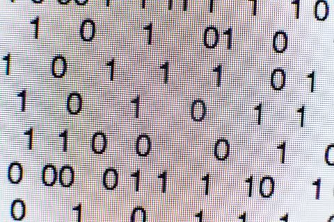 Binary code on a computer screen 스톡 사진