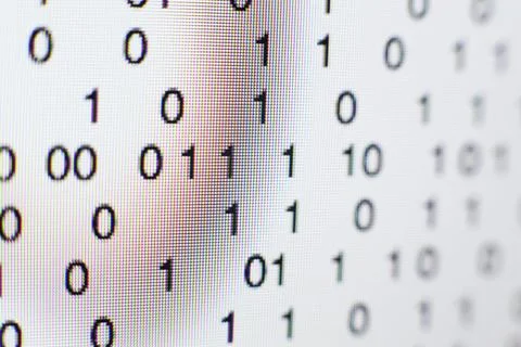 Binary code on a computer screen Stock Photos