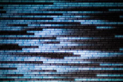 Binary code data bit screen display on laptop computer screen. matrix of data Stock Photos