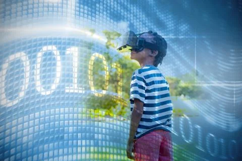Binary code on digital screen against happy boy using 3d glasses Foto stock