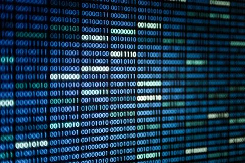 Binary code on display screen. white blue light green colors number one and z Stock Photos