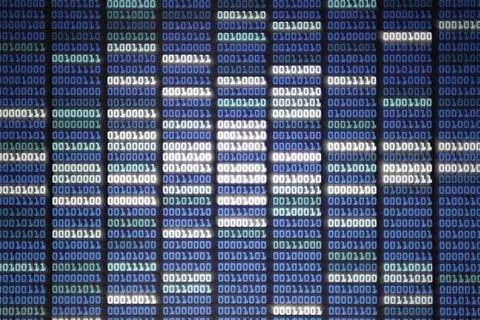 Binary code on display screen. white blue light green colors number one and z Stock Photos