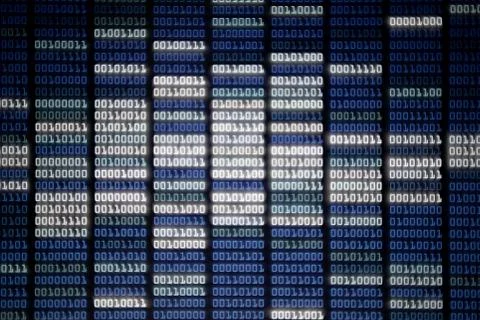 Binary code on display screen. white blue light green colors number one and z Stock Photos