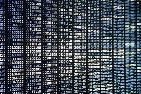 Binary code on display screen. white blue light green colors number one and z Foto stock