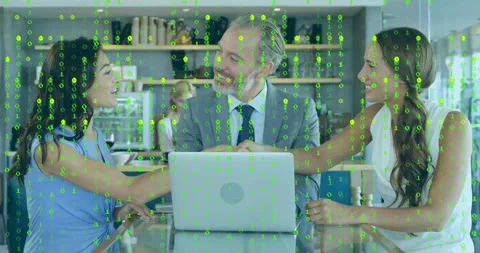Binary code falling then fading, showing team shaking hands over laptop for tech Stock Footage 318237666