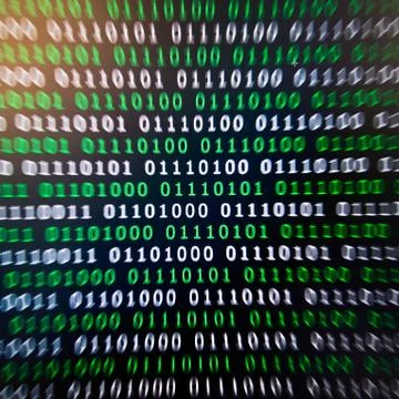 Binary code green blue digital color on black background with zoom effect for 写真素材