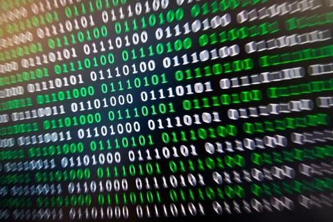 Binary code green blue digital color on black background with zoom effect for 写真素材