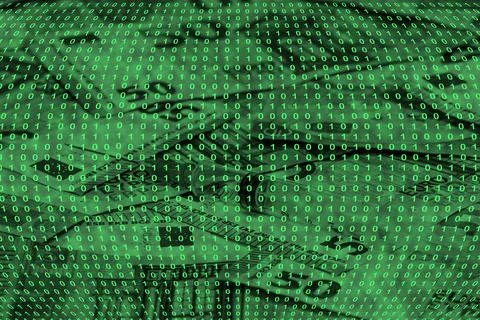 Binary code grid from bright green numbers on the background of euro banknote Foto stock