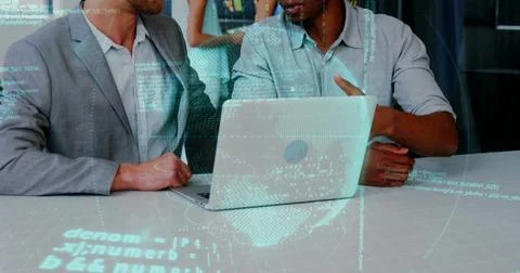 Binary code image over business people discussing work at laptop 库存照片