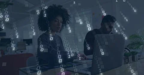 Binary code image over diverse people working on laptops in office Stock-Fotos