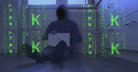 Binary code instead of face of a hooded programmer sitting on floor with laptop Video stock 237362877