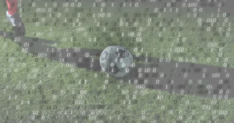 Binary code intensifying while soccer player approaching ball and kicking for Stock Footage 318758479