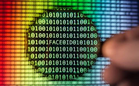 Binary code screen Binary code, Magnifying glass shows Face ID, phone auth... 库存照片