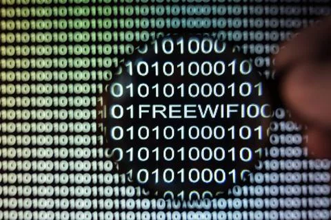Binary code screen Binary code, magnifying glass shows public free wireles... Stock Photos