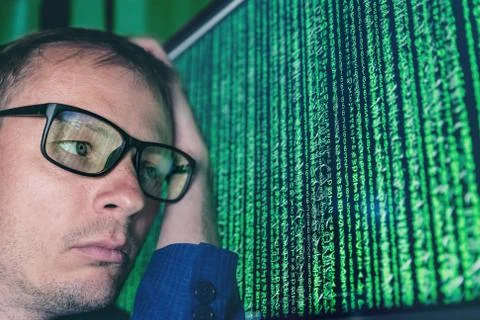 Binary code on the screen. Person has a problem with a computer. Stockfoto's