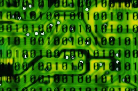 Binary code superimposed on a circuit board Foto stock