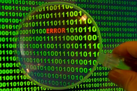 Binary code with the word Error viewed through a magnifying glass 库存照片