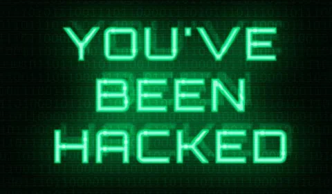 Binary code with the words You have been hacked 库存照片