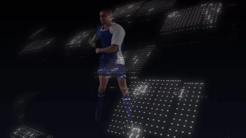 Binary coding and glowing dots pattern over male soccer player kicking the ball Stock Footage 328410654