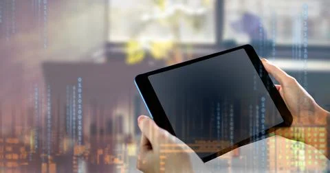 Binary coding data processing against person holding digital tablet Stock Photos